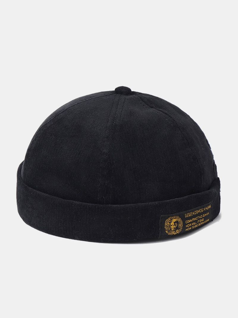 Menn Og Kvinner Corduroy Justerbar Solide Bokstaver Klut Patch Retro Krympende Brimless Lue Beanie Utleier Cap Skull Cap