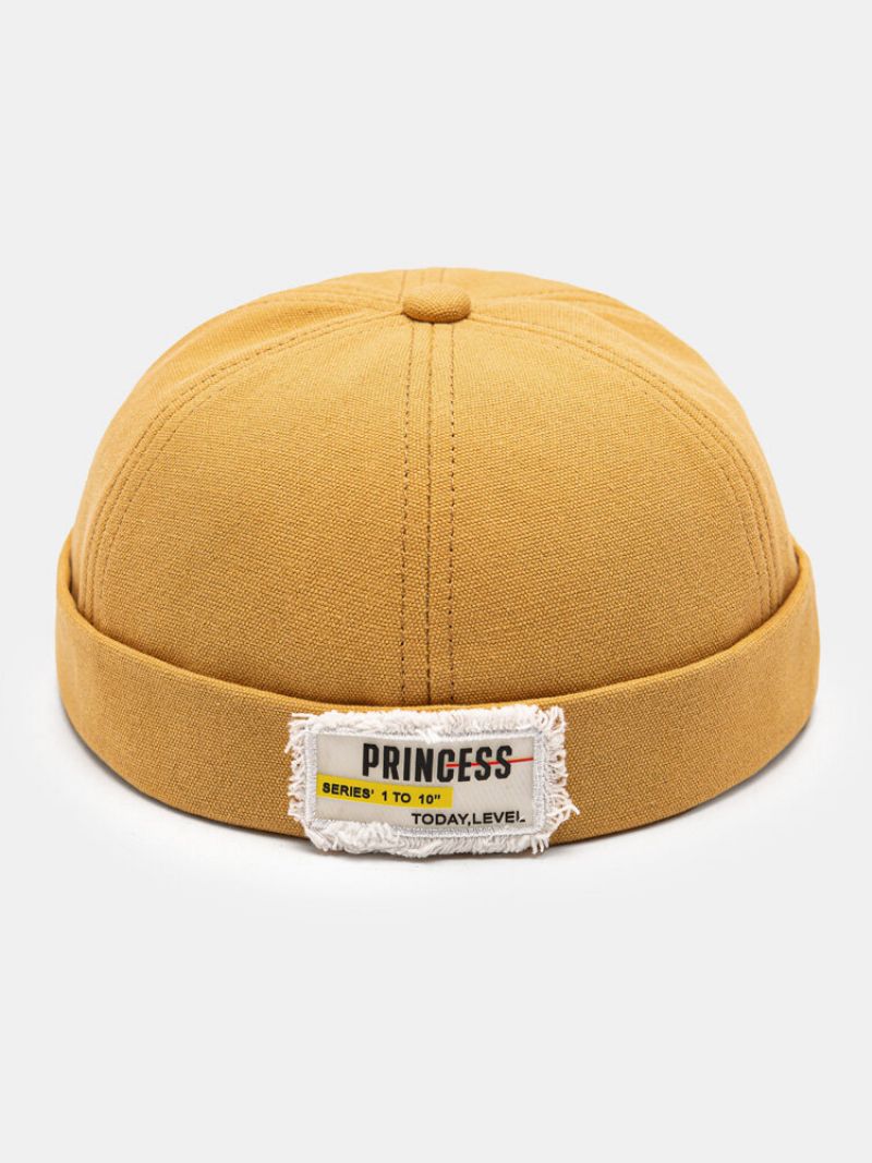 Unisex Polyester Bomull Solide Bokstaver Mønster Råkant-etikett All-match Brimless Beanie Landlord Cap Skull Cap