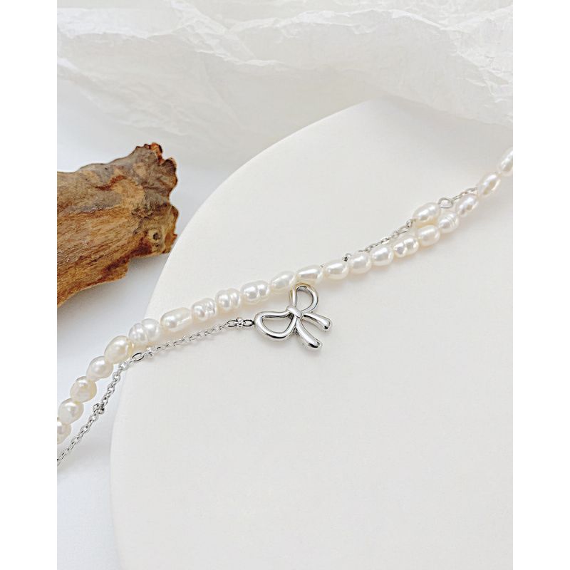 Hollow Bow Pearl Texture Titanium Steel Halskjede Ins Nisje Design Clavicle Chain