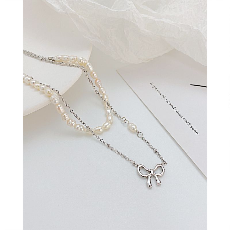 Hollow Bow Pearl Texture Titanium Steel Halskjede Ins Nisje Design Clavicle Chain