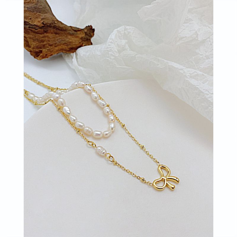 Hollow Bow Pearl Texture Titanium Steel Halskjede Ins Nisje Design Clavicle Chain